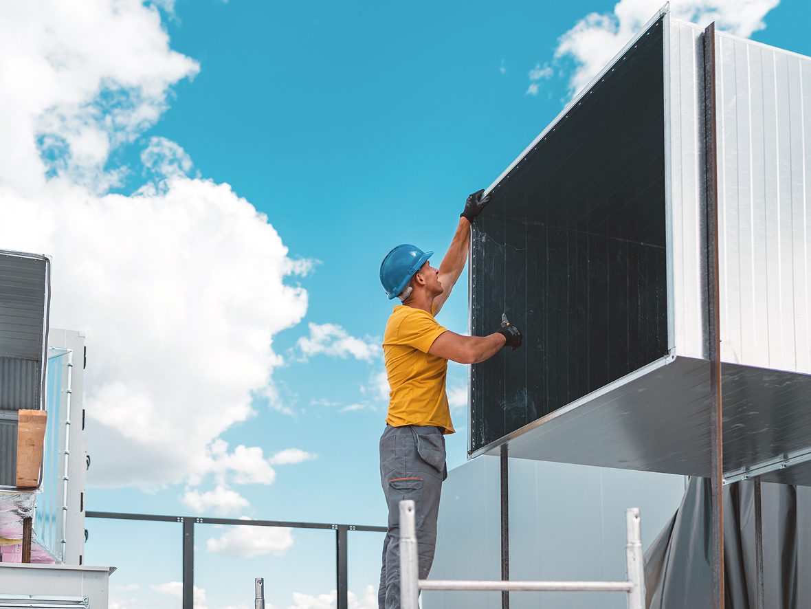 Construction worker assembling metal structure